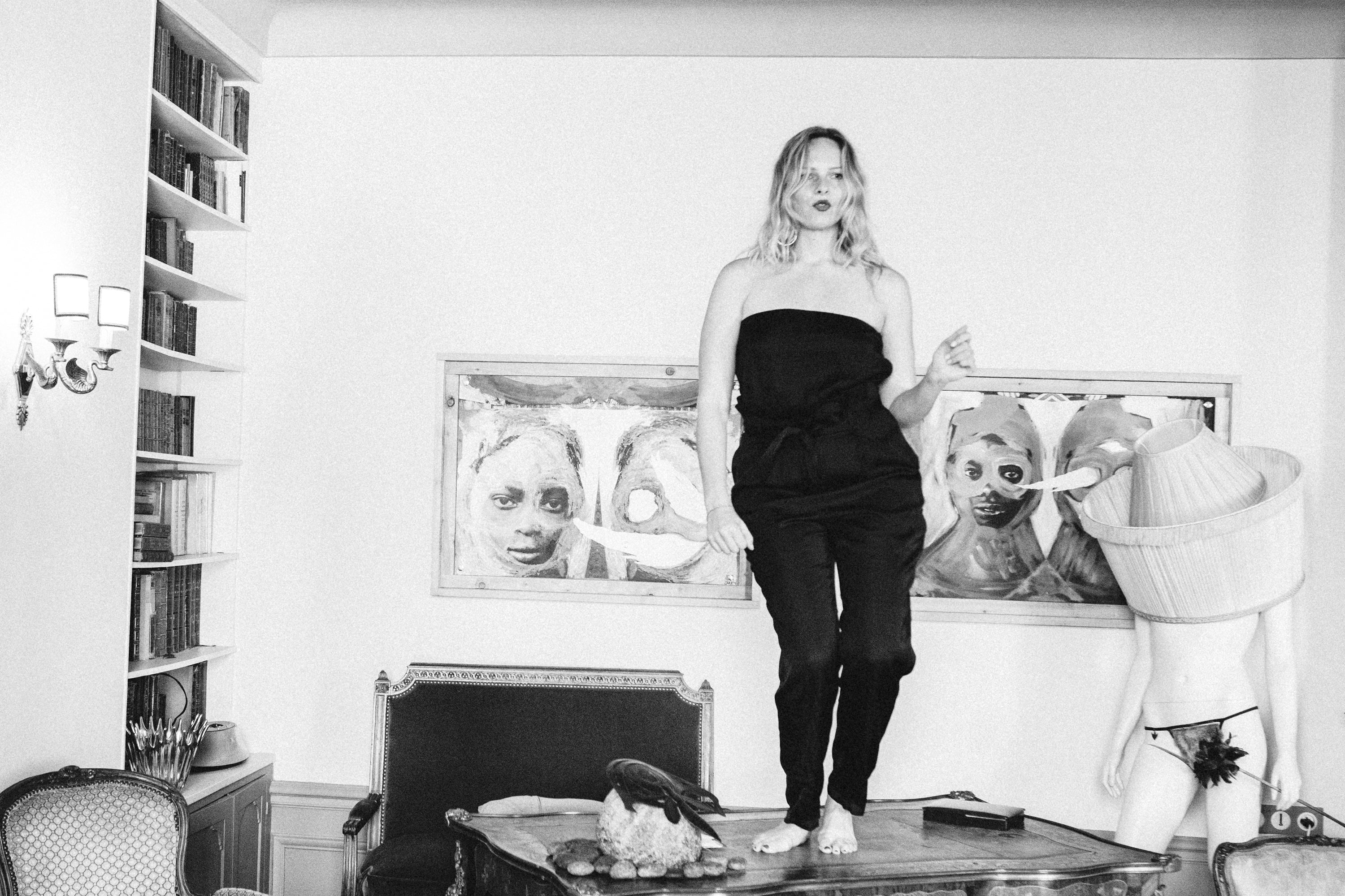Black and white film noir portrait, woman in a Paris flat, Carla Coulson photography