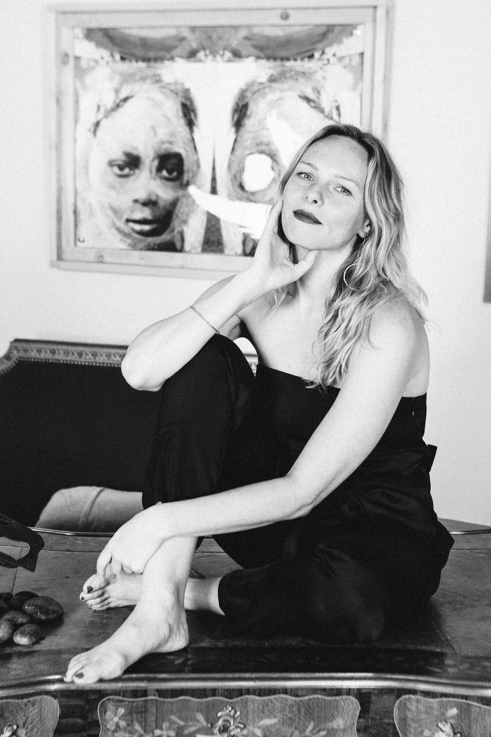 Moody black and white portrait of a woman in a Paris flat, film noir style by Carla Coulson