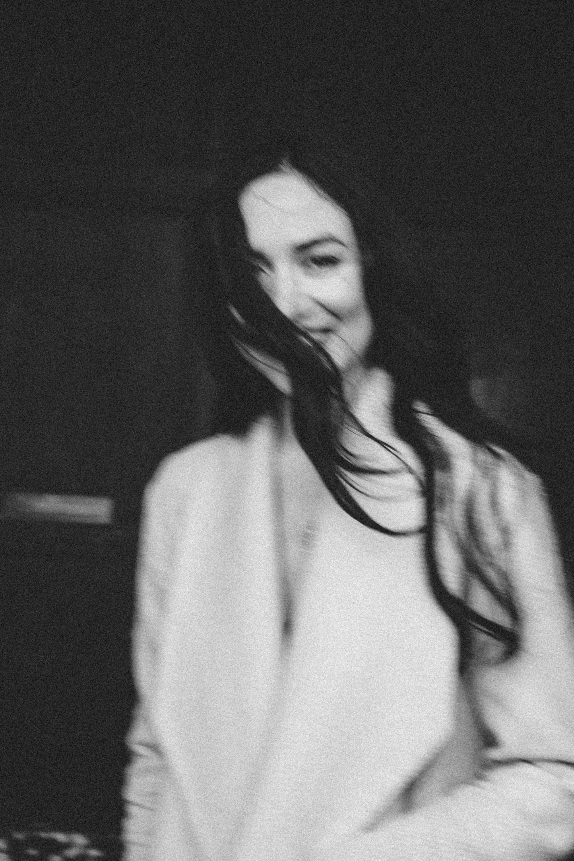 Moody black and white film noir portrait of a woman in Paris, atmospheric photography by Carla Coulson