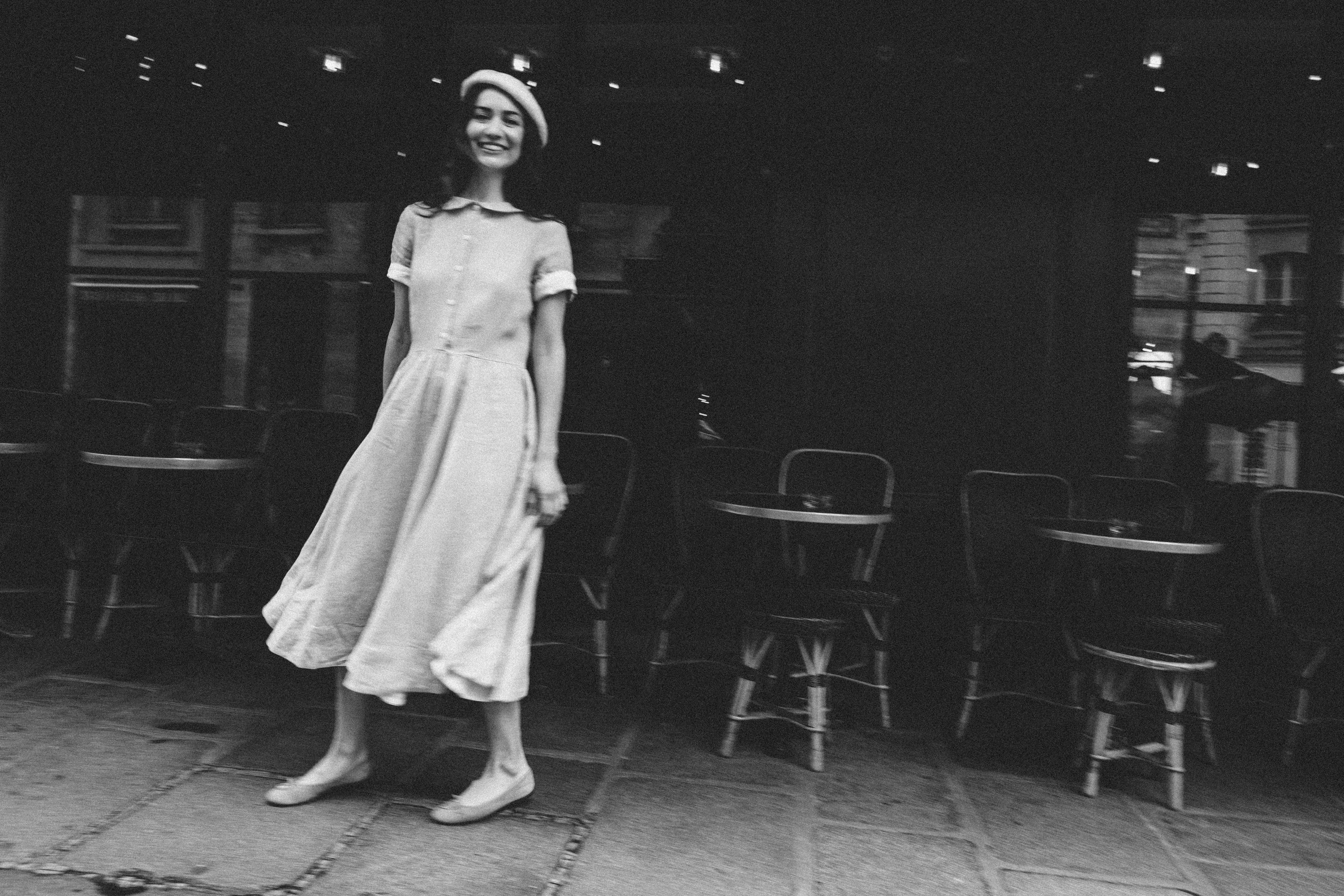 Dramatic black and white film noir portrait of a woman in Paris, editorial photography by Carla Coulson