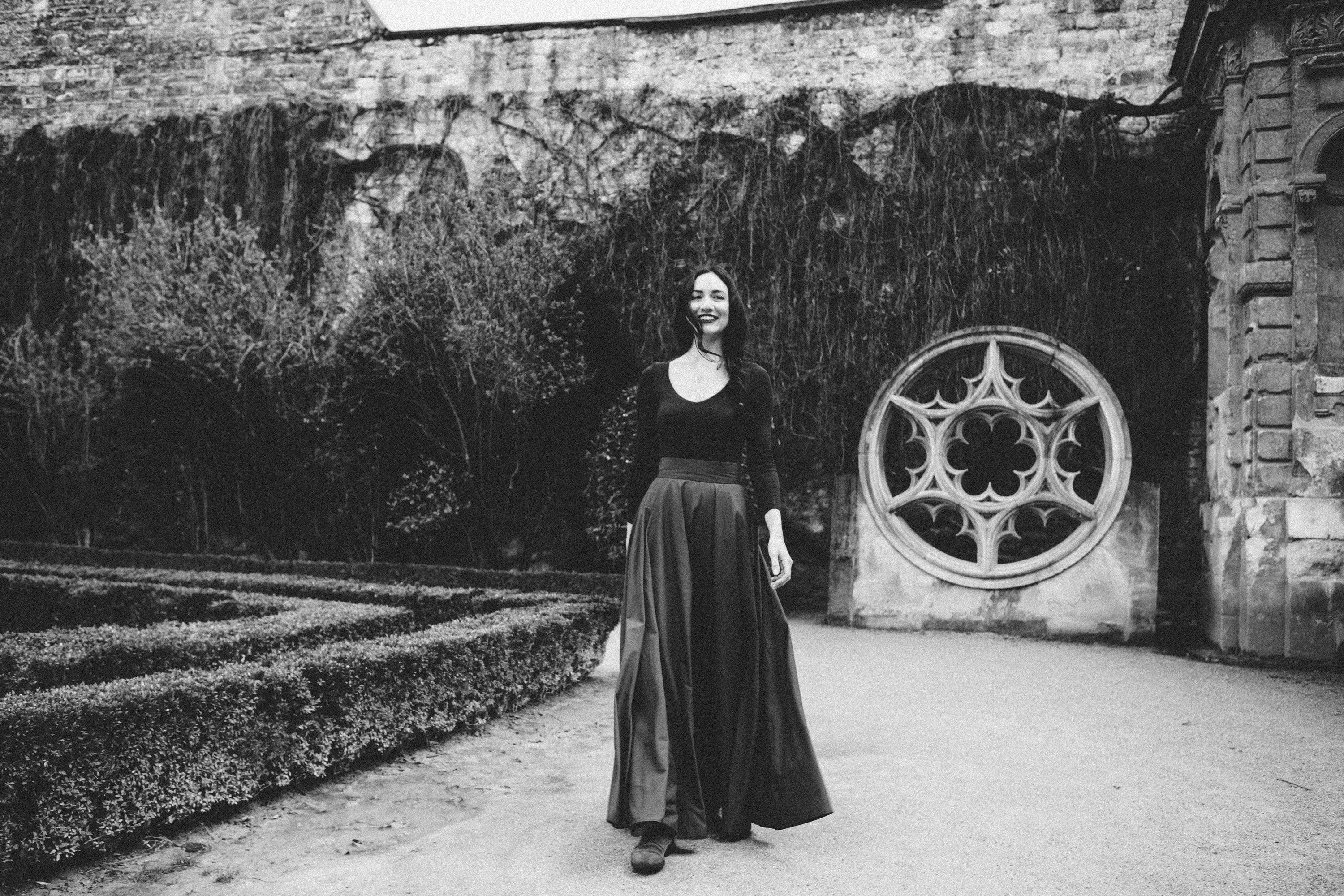 Atmospheric film noir black and white portrait of a woman in a Parisian location, Carla Coulson photography