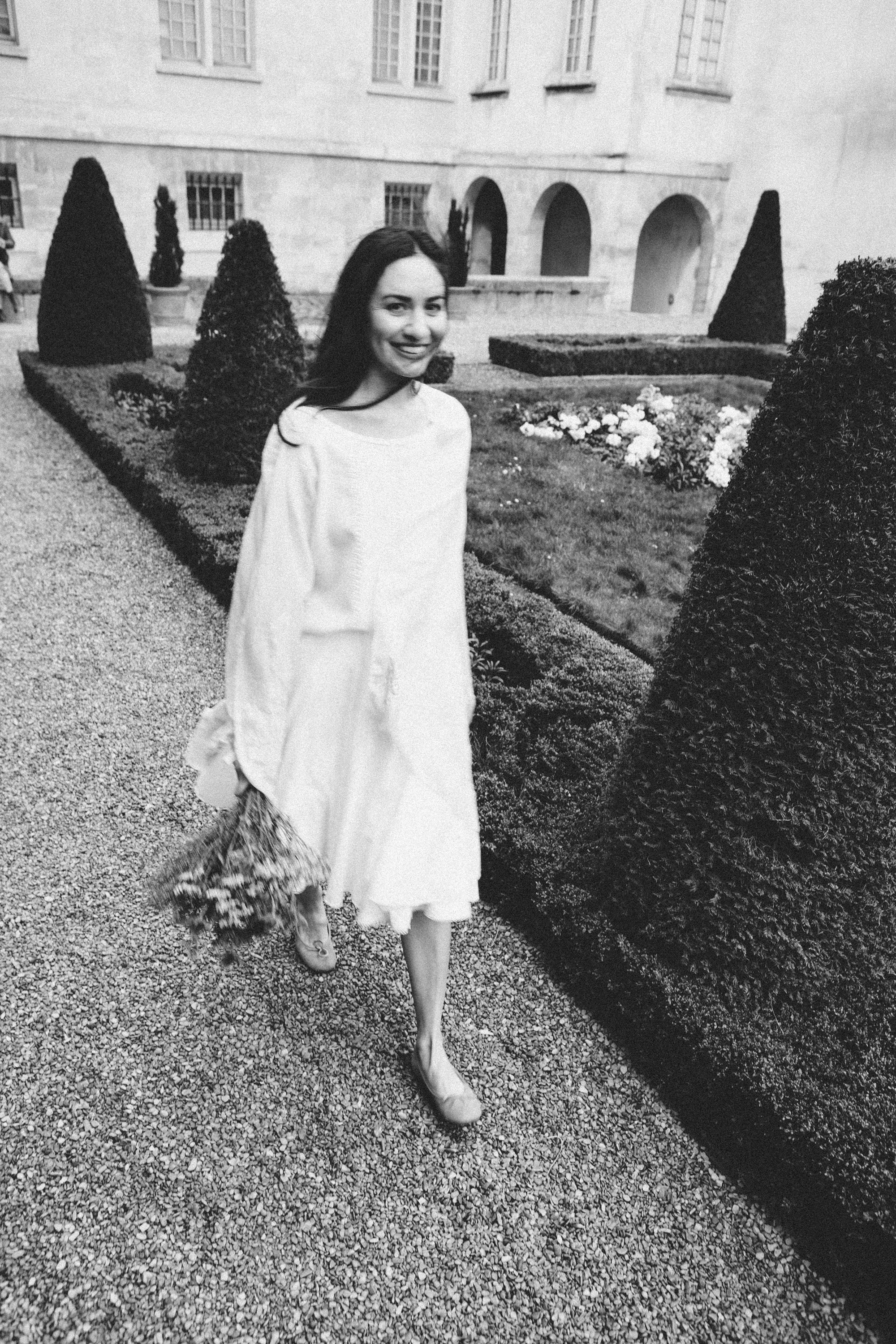 Monochrome film noir portrait of a woman in Parisian garden, intimate black and white photography by Carla Coulson