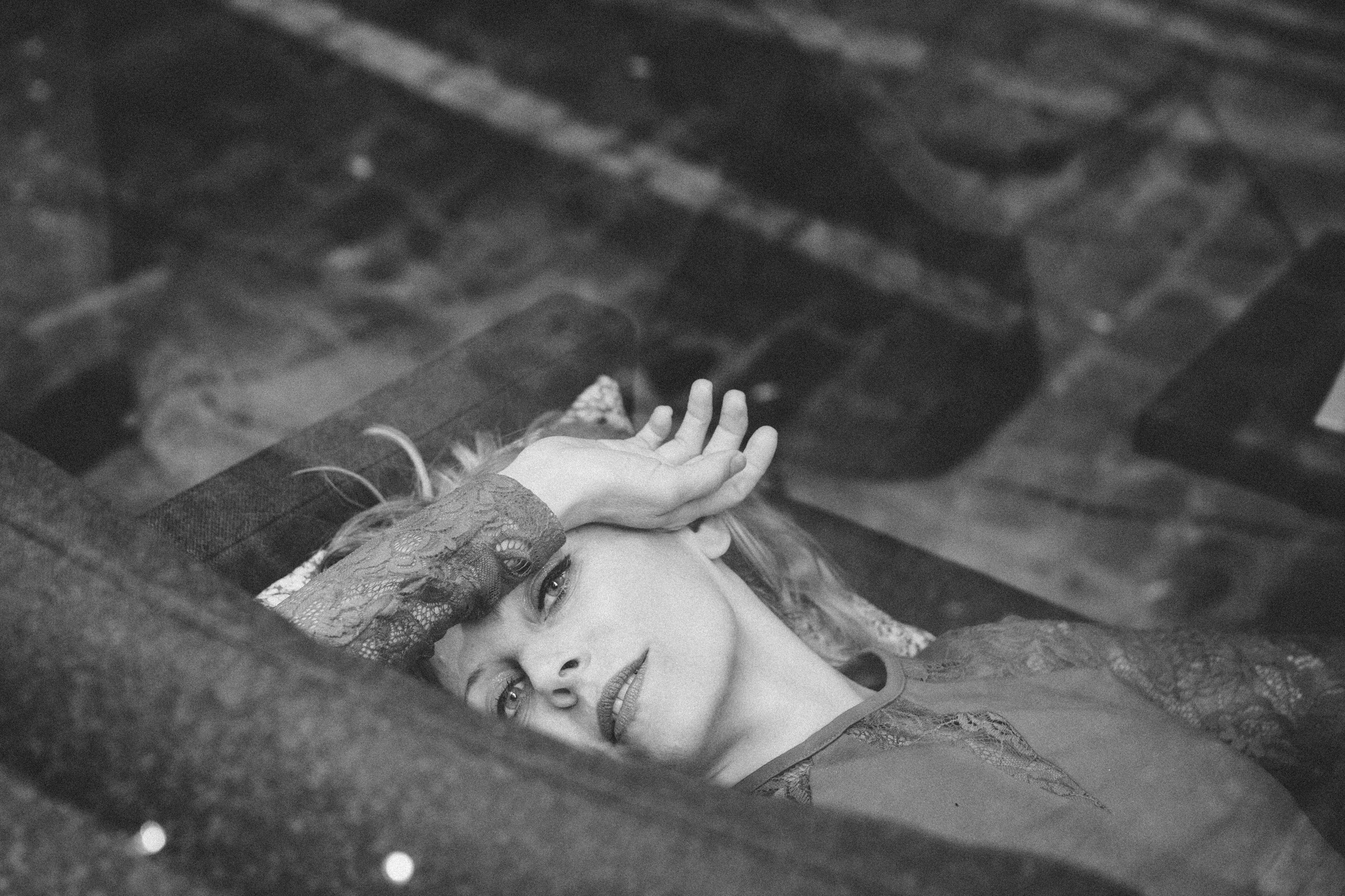 Dramatic film noir portrait of a woman in Paris, wide-format black and white photography by Carla Coulson