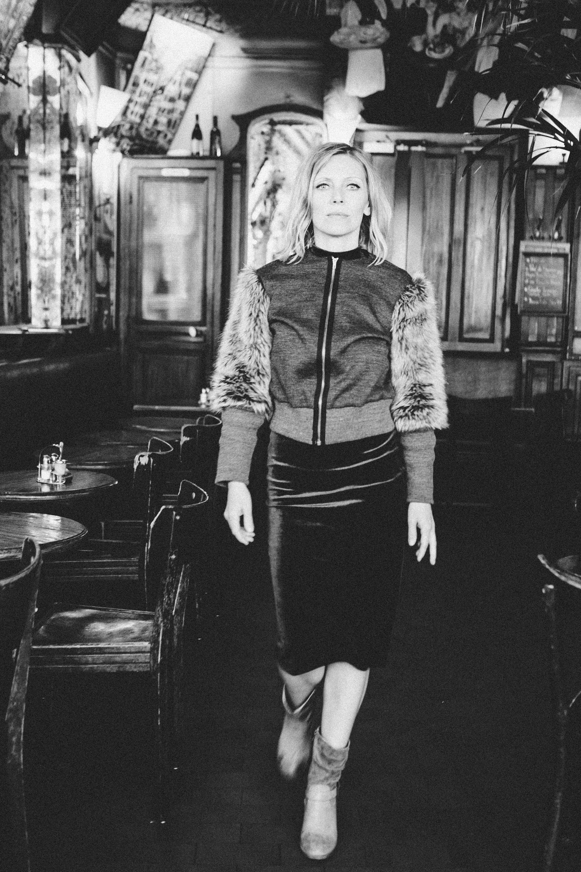 Intimate black and white film noir portrait of a woman in Paris, photography by Carla Coulson