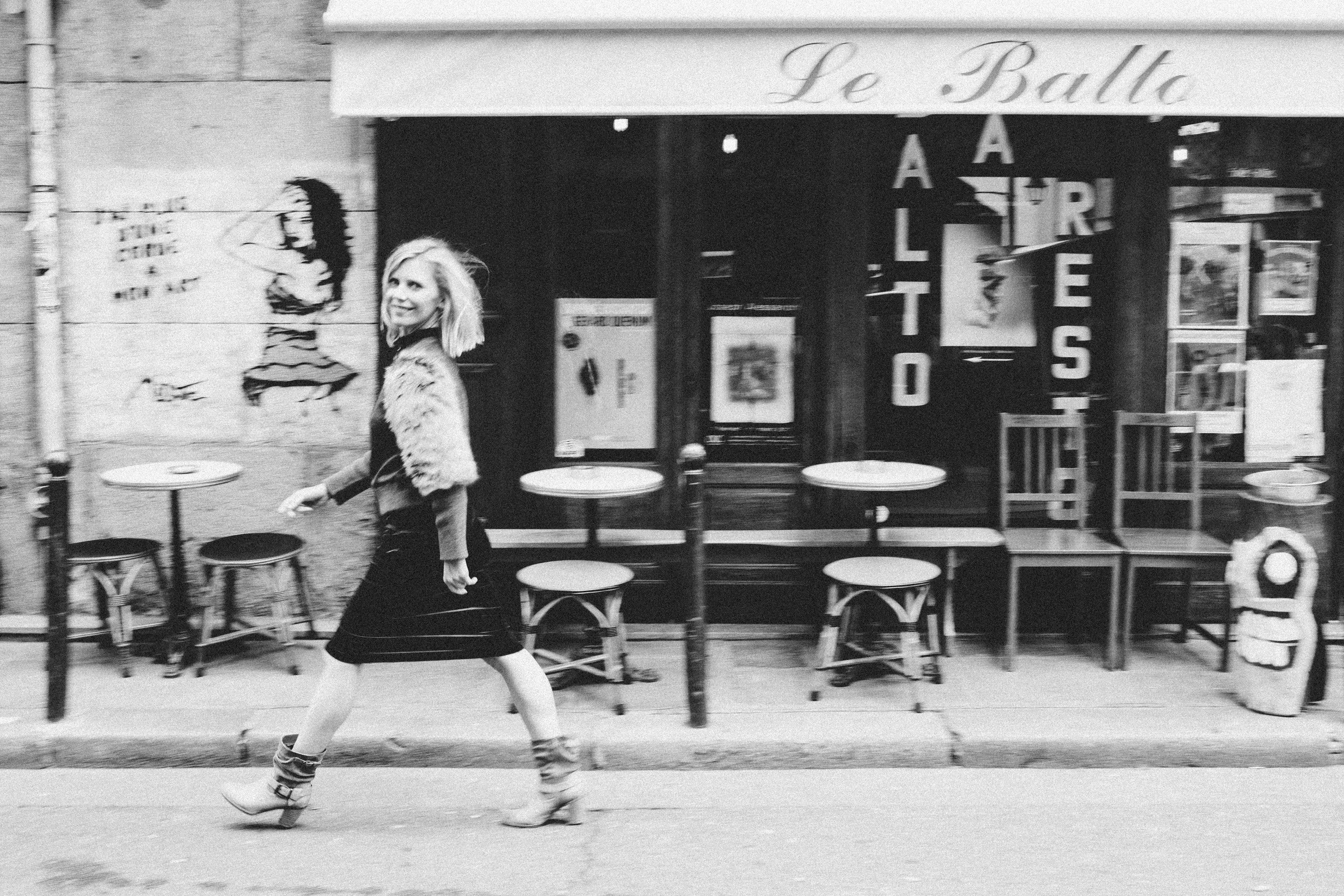 Dramatic wide-format film noir portrait of a woman in Paris, black and white photography by Carla Coulson