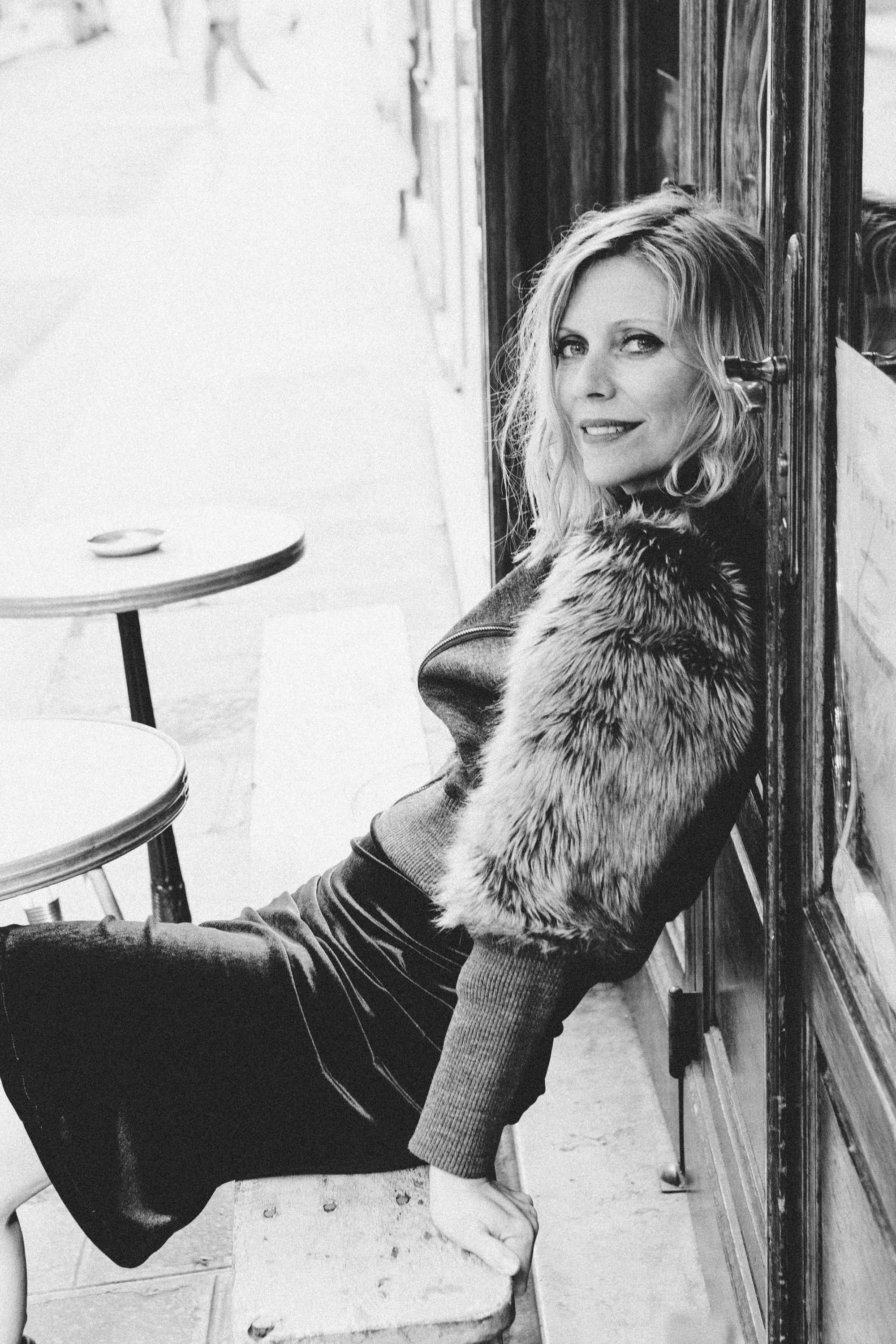 Moody monochrome portrait of a woman in Paris, film noir black and white photography by Carla Coulson