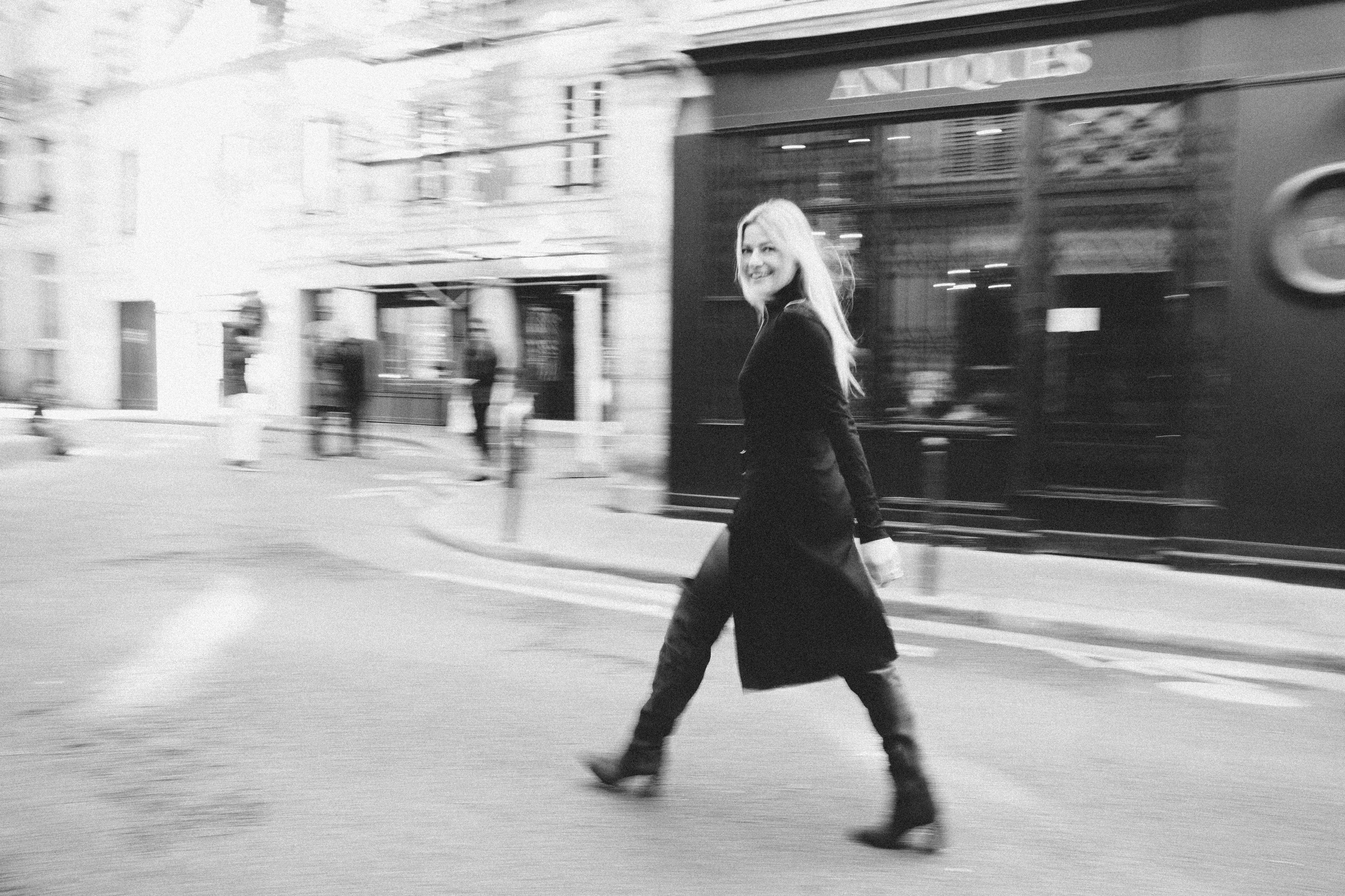 Cinematic black and white film noir portrait of a woman in Paris, wide-format photography by Carla Coulson