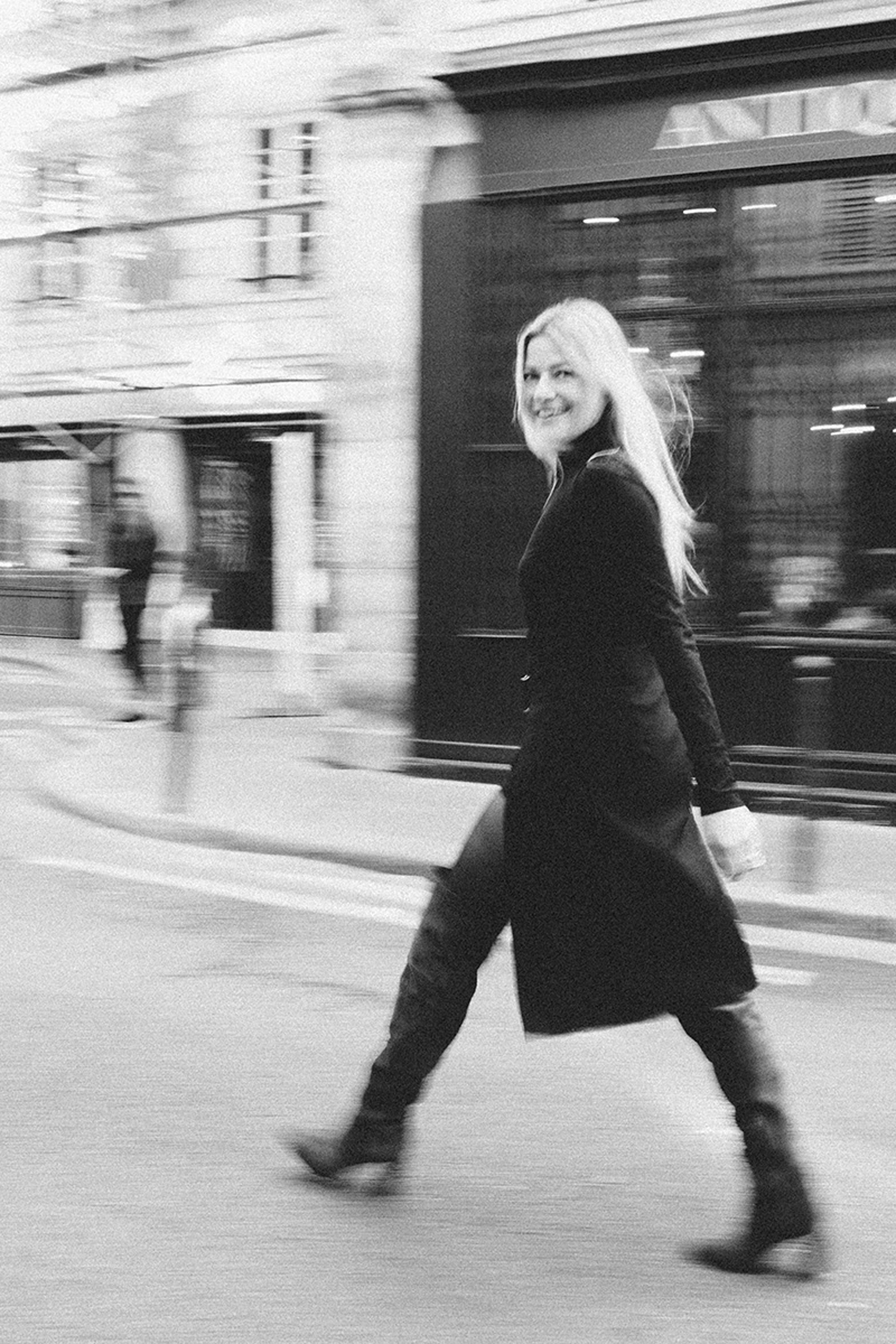 Intimate film noir portrait of a woman in a Parisian location, monochrome photography by Carla Coulson