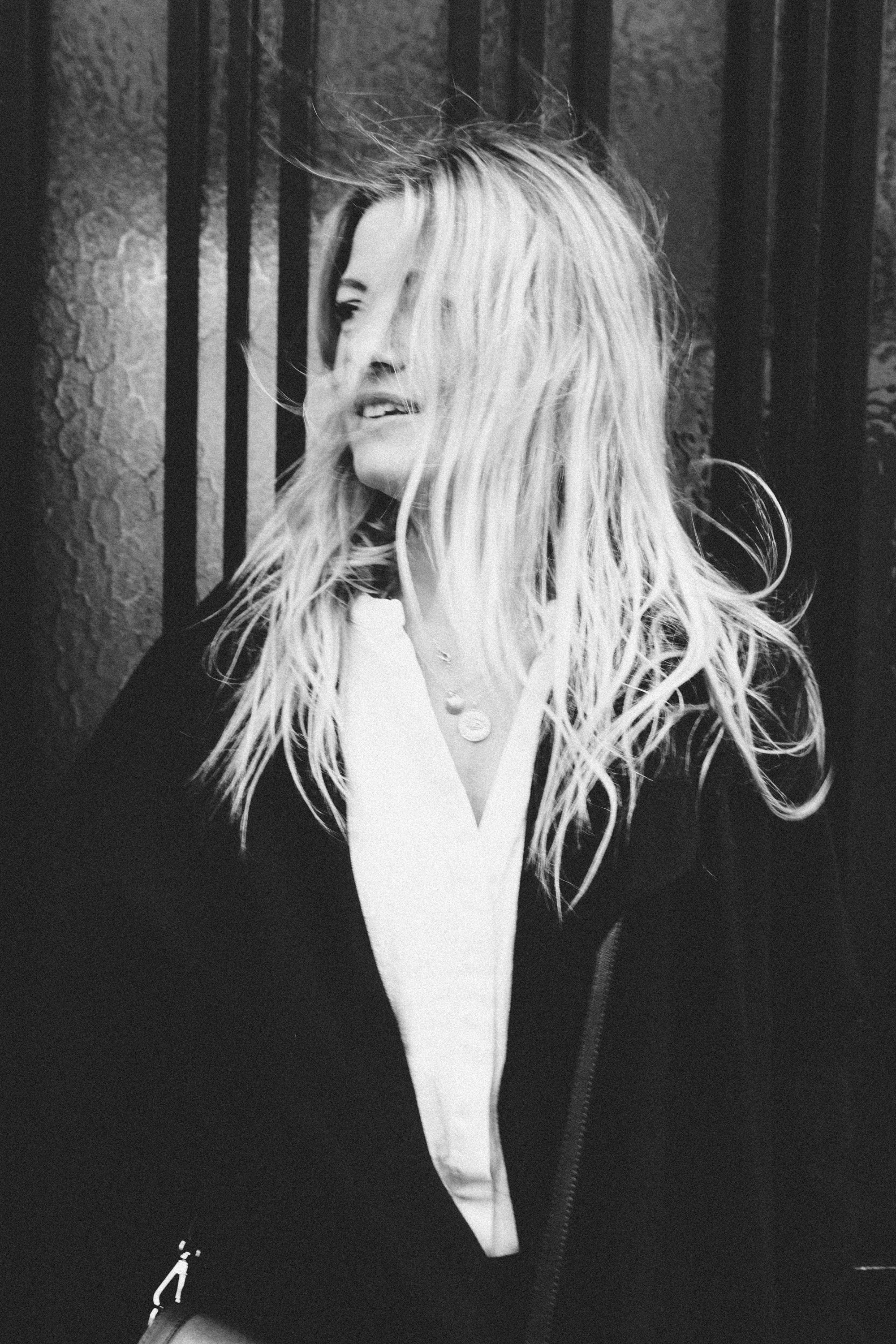 Atmospheric black and white portrait of a woman in Paris, film noir style photography by Carla Coulson