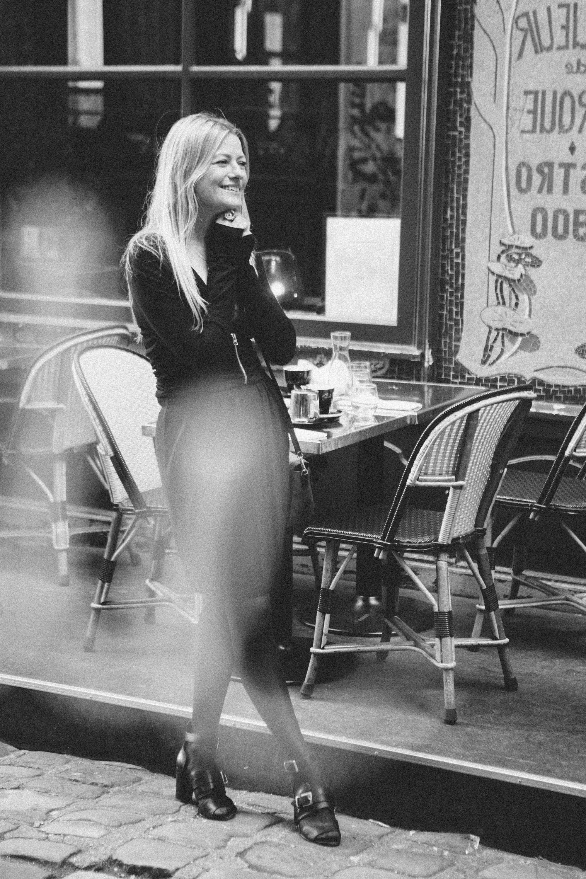 Black and white film noir portrait of a woman on a Paris street, Carla Coulson photography