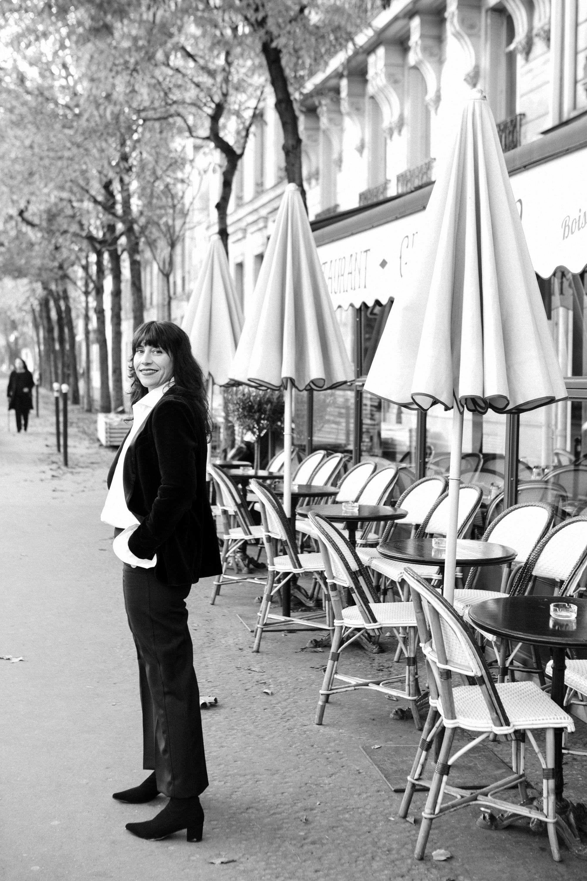 Atmospheric black and white film noir portrait of a woman in Paris, photography by Carla Coulson