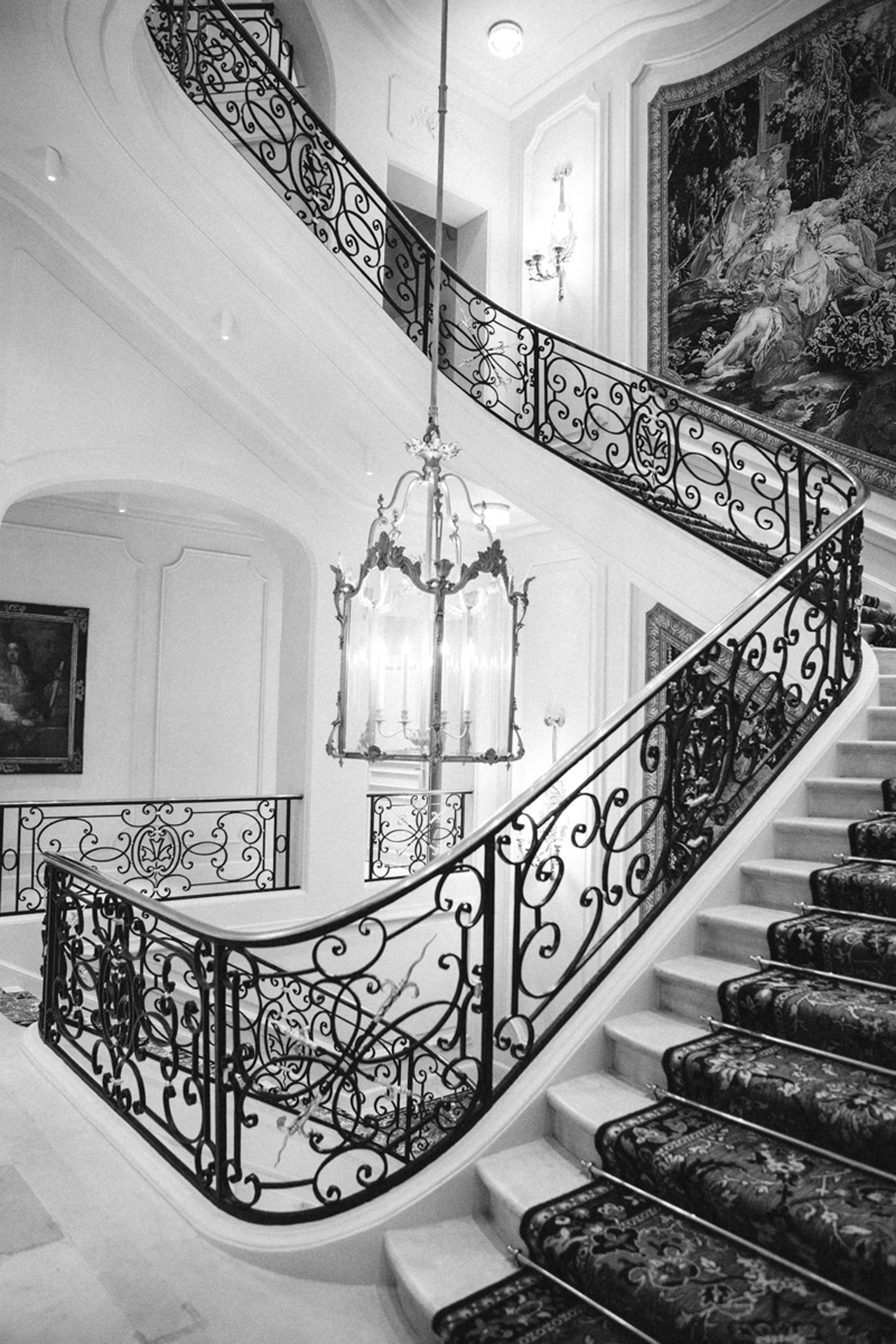 Ritz Paris hotel grand staircase atmospheric lighting — luxury property photography by Carla Coulson
