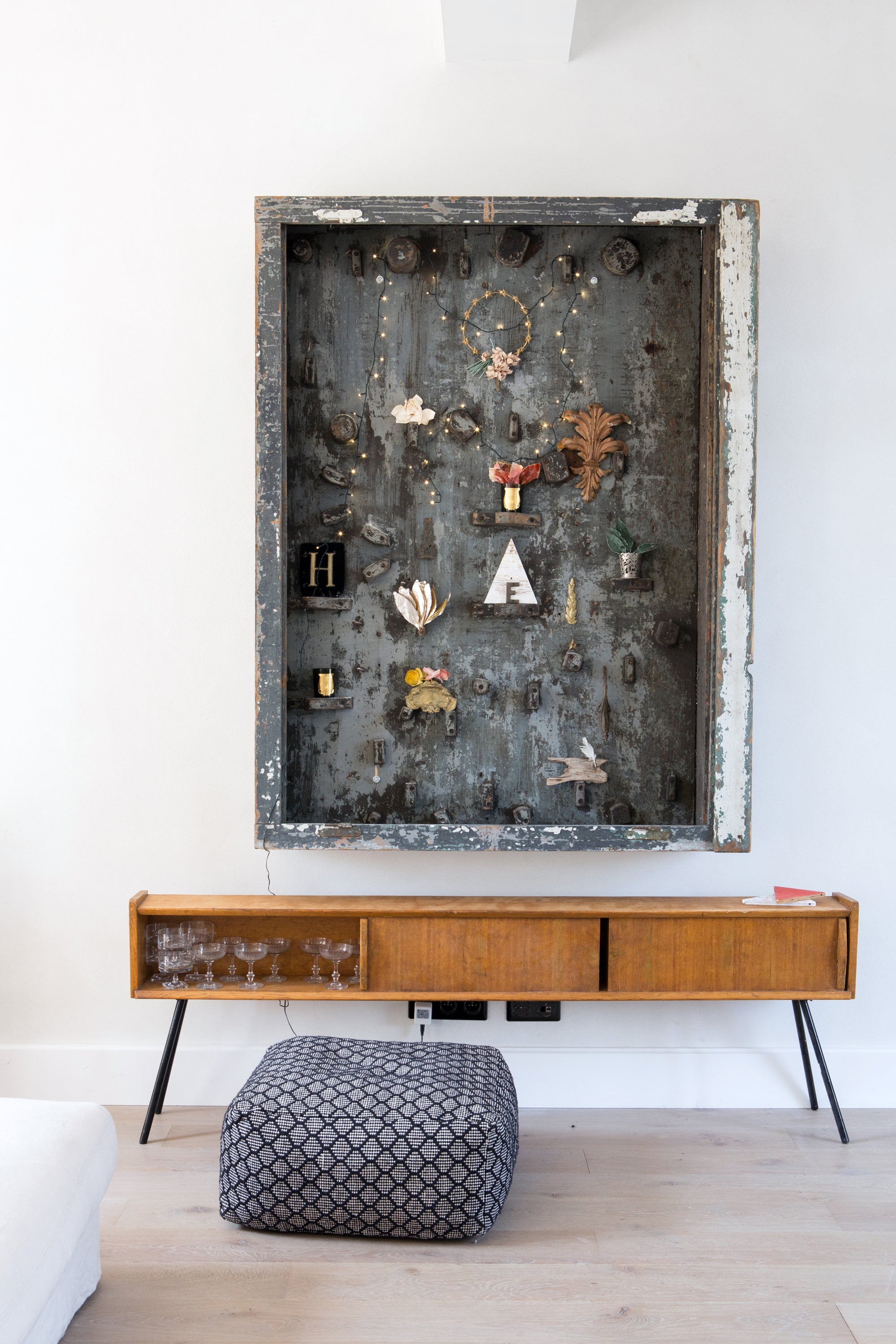 Wooden console table with decorative items against a white wall, bedroom with soft ambient light — luxury lifestyle photography by Carla Coulson